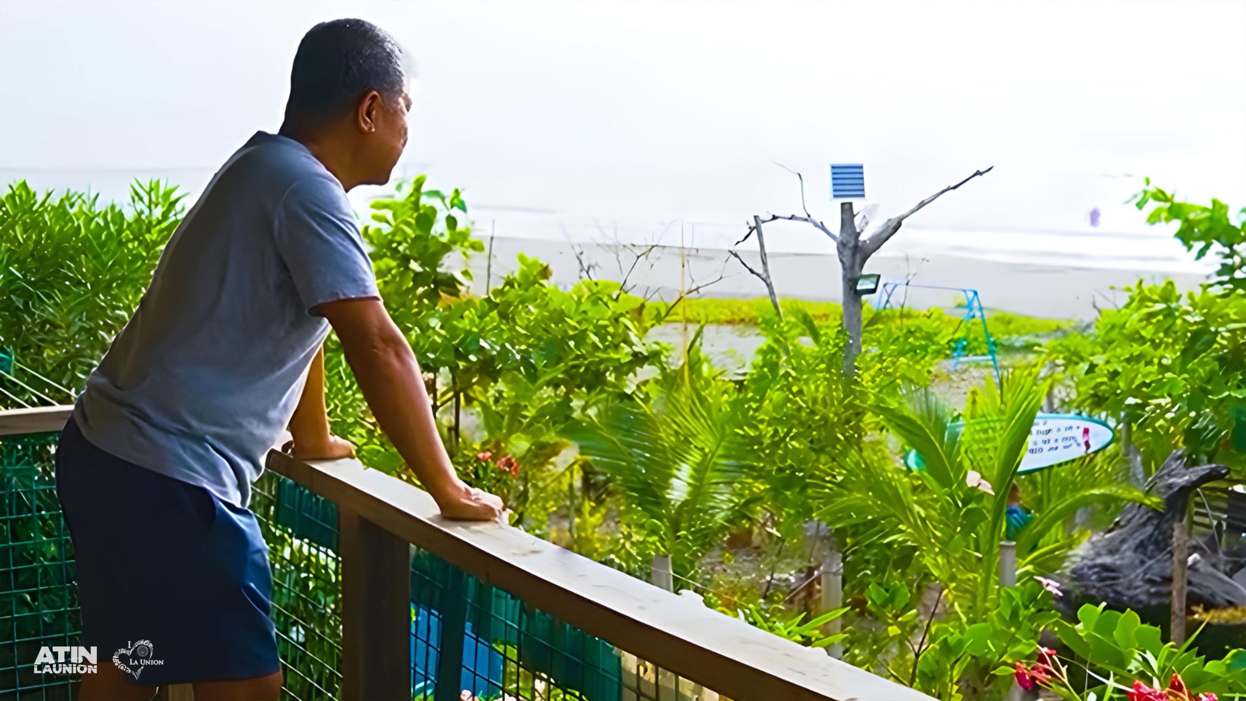 A man looking at the farm view of the agri-tourism site Ibit's Farm Beach Resort.